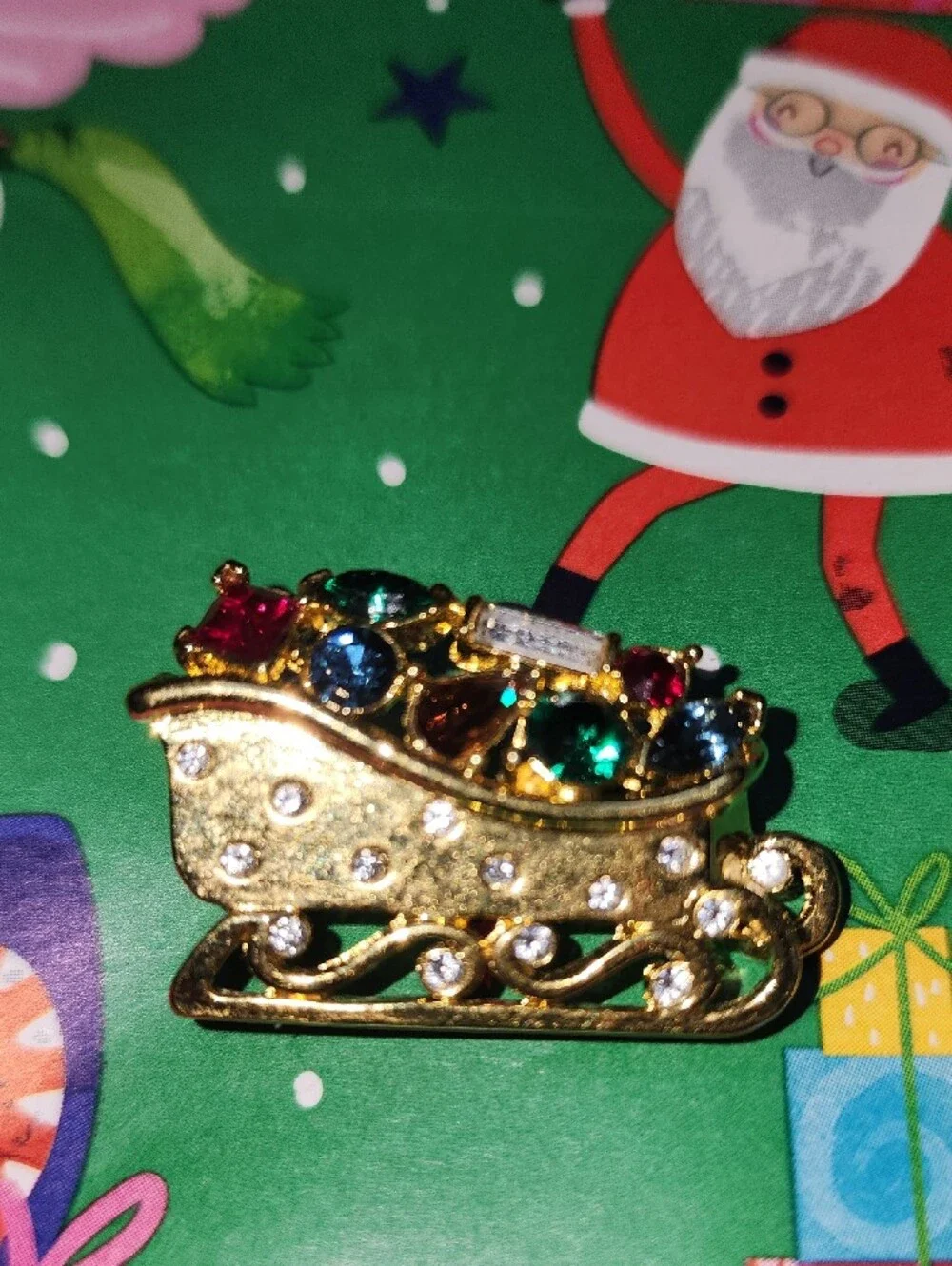 Monet Gold-tone Festive Sleigh Brooch with Multicolor Rhinestones